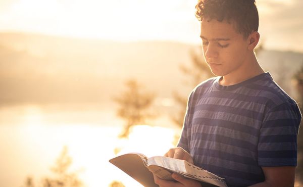 Young man reading the bible